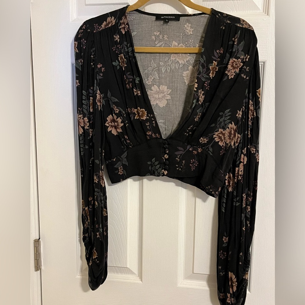 Pretty and sexy black floral blouse with buttons at the waistband